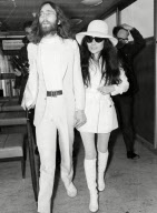 John Lennon And Yoko Ono Arrive At Heathrow Airport From Vienna On April 1 Making Their Way To The Press Lounge To Face The British Camera Crews. John''s Involvement With The Peace Movement Came At A Time When He Desperately Needed Something To Distr