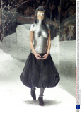 Model Stella Tennant Wears A Silver Metallic Bodice By British Designer Alexander Mcqueen During His Show On The Fourth Day Of London Fashion Week In Victoria London Tuesday Feb.23 1999. The Models Were On A Set That Was Enclosed By Perspex. Mcqueen
