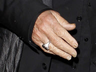 Al Pacino shows his gnarly fingernails while dining with Lucila Sola