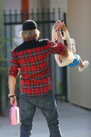 Gabriel Aubry has a hold on little Nahla's hand on his way to drop her off at school