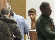 Half-naked Justin Bieber goes through airport security in Poland NO USE IN POLAND
