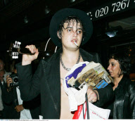 Scandal-singer PETE DOHERTY shows off his buffing pale belly in London