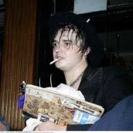 Scandal-singer PETE DOHERTY shows off his buffing pale belly in London