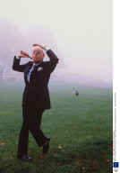 DENIS THATCHER PLAYING GOLF AT A TRADE EXHIBITION AT SANDOWN PARK, BRITAIN - 1989