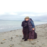 Mother photographs Julian Becker and Max the dog for his Naval officer father, Whidbey Island, Washington, America - Apr 2013