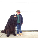 Mother photographs Julian Becker and Max the dog for his Naval officer father, Whidbey Island, Washington, America - Apr 2013