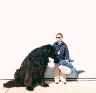 Mother photographs Julian Becker and Max the dog for his Naval officer father, Whidbey Island, Washington, America - Apr 2013