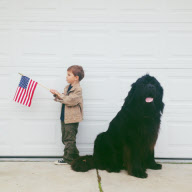Mother photographs Julian Becker and Max the dog for his Naval officer father, Whidbey Island, Washington, America - Apr 2013