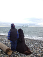 Mother photographs Julian Becker and Max the dog for his Naval officer father, Whidbey Island, Washington, America - Apr 2013