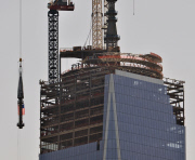 Spire of WTC Tower One lifted to top
