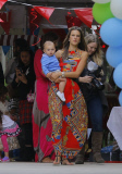 Alessandra Ambrosio gives cupcakes to photographers!