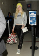 ELLE FANNING ARRIVES AT LAX