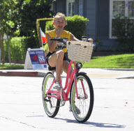 Noah Cyrus looks so tiny on her big bike!
