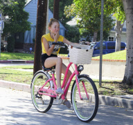 Noah Cyrus looks so tiny on her big bike!