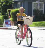 Noah Cyrus looks so tiny on her big bike!