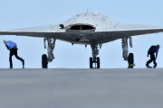 An X-47B Unmanned Combat Air System demonstrator launches from the flight deck of the aircraft carrier USS George H.W. Bush, Atlantic Ocean - 14 May 2013