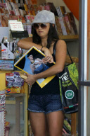 *EXCLUSIVE* Catherine Giudici hides underneath her cap for a Newsstand run
