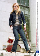 Ben Affleck helps Gwyneth Paltrow into a vehicle as the two leave the Four Seasons Hotel in Boston on Saturday. Paltrow has been walking with a cane while nursing an undisclosed injury to her left foot.