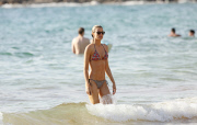Eddie Murphy's girlfriend Paige Butcher takes a dip in the warm Hawaiian ocean