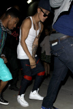 Justin Bieber leaves Kanye's party like a linebacker **NO Australia, New Zealand**