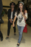 Lucy Hale Arriving at LAX with a smile looking grunge cute
