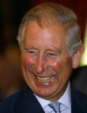 Britain's Prince Charles laughs as he talks with people, during a reception for Kindertransport refugees and members of their families to commemorate the 75th anniversary of the Kindertransport, at St. James's Palace, in central London, Monday, June 24, 2