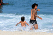 Real Madrid player Marcelo hits the beach with his family in Rio