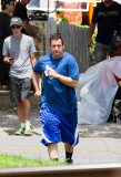 Nice guy Adam Sandler runs out to greet fans before filming