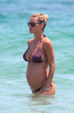 MICHELLE HUNZIKER ENJOYS A DAY AT THE BEACH IN IBIZA