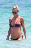 MICHELLE HUNZIKER ENJOYS A DAY AT THE BEACH IN IBIZA