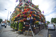 The Churchill Arms pub and its famous hanging baskets of flowers, Kensington Church St, London, Britain - 26 Jul 2013