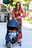 Mirand Kerr carries a sleepy Flynn