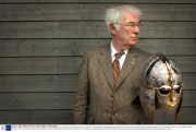 SEAMUS HEANEY AUTHOR OF THE ACCLAIMED TRANSLATION OF BEOWULF HOLDS A REPLICA OF THE SUTTON HOO HELMET AT THE OPENING OF A NEW EXHIBITION CENTRE AT THE SUTTON HOO SITE WHICH INCLUDES TREASURES LENT BY THE BRITISH MUSEUM.  13/3/02