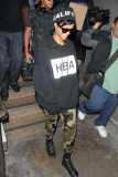 Rihanna marches through LAX after bodyguard goes ballistic on photographer