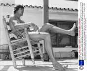Former World Motor Racing Champion James Hunt Relaxes And Tops Up His Tan. The Lure Of The Sport Is Still Great However And He Would Soon Be Back As A Tv Pundit. 10/6/1979