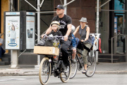Naomi Watts and Liev Schreiber bike the kids to school