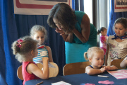 First Lady Michelle Obama lends a hand at a new USO center for Wounded Warriors