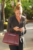 Uma Thurman Walking Her Dog and Holding a Porsche Design Twin Bag