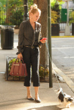 Uma Thurman Walking Her Dog and Holding a Porsche Design Twin Bag