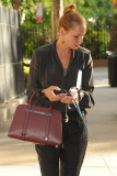 Uma Thurman Walking Her Dog and Holding a Porsche Design Twin Bag