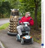 Man transports lifesize Dr Who Dalek prop by towing it behind a mobility scooter, Hampshire, Britain - 21 Sep 2013