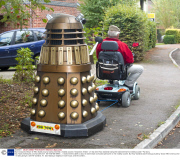 Man transports lifesize Dr Who Dalek prop by towing it behind a mobility scooter, Hampshire, Britain - 21 Sep 2013