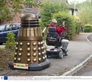 Man transports lifesize Dr Who Dalek prop by towing it behind a mobility scooter, Hampshire, Britain - 21 Sep 2013