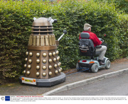 Man transports lifesize Dr Who Dalek prop by towing it behind a mobility scooter, Hampshire, Britain - 21 Sep 2013