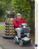 Man transports lifesize Dr Who Dalek prop by towing it behind a mobility scooter, Hampshire, Britain - 21 Sep 2013