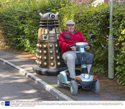Man transports lifesize Dr Who Dalek prop by towing it behind a mobility scooter, Hampshire, Britain - 21 Sep 2013