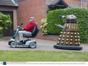 Man transports lifesize Dr Who Dalek prop by towing it behind a mobility scooter, Hampshire, Britain - 21 Sep 2013