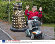 Man transports lifesize Dr Who Dalek prop by towing it behind a mobility scooter, Hampshire, Britain - 21 Sep 2013