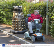 Man transports lifesize Dr Who Dalek prop by towing it behind a mobility scooter, Hampshire, Britain - 21 Sep 2013