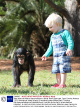 Baby chimp and little boy become friends at Myrtle Beach Safari park, South Carolina, America - 2013